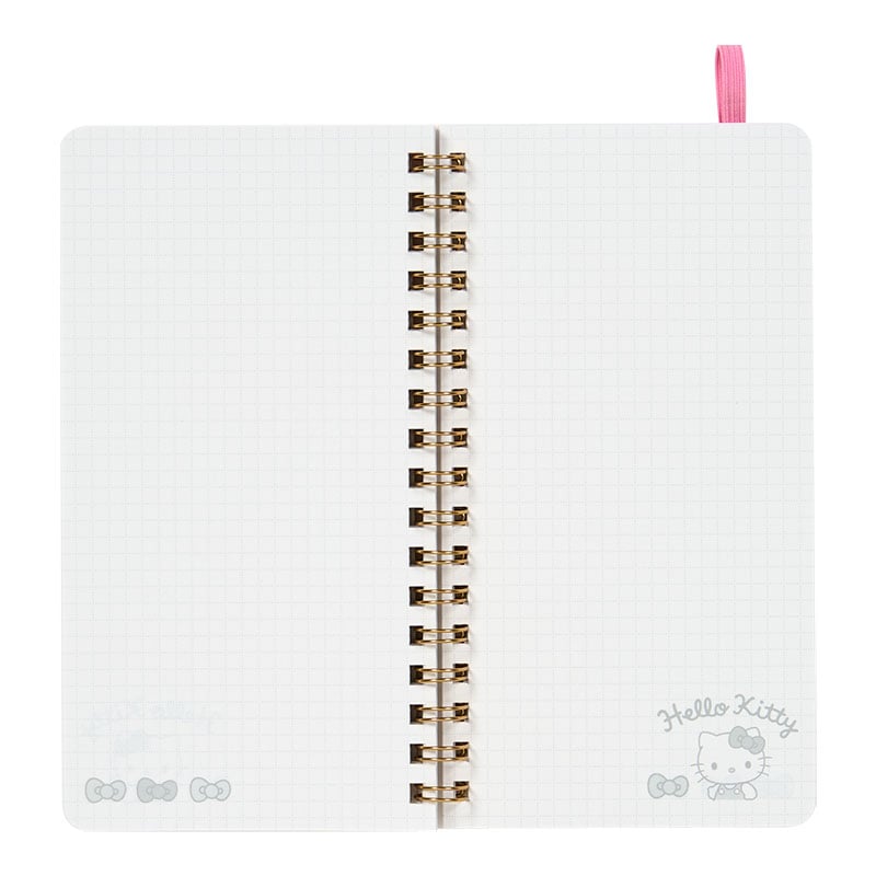 Open view of the Hello Kitty spiral notebook, showing ruled pages for bullet journaling.