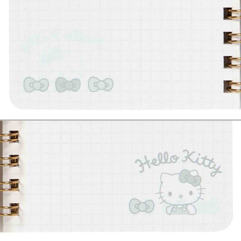 Open view of the Hello Kitty spiral notebook, showing ruled pages for bullet journaling.
