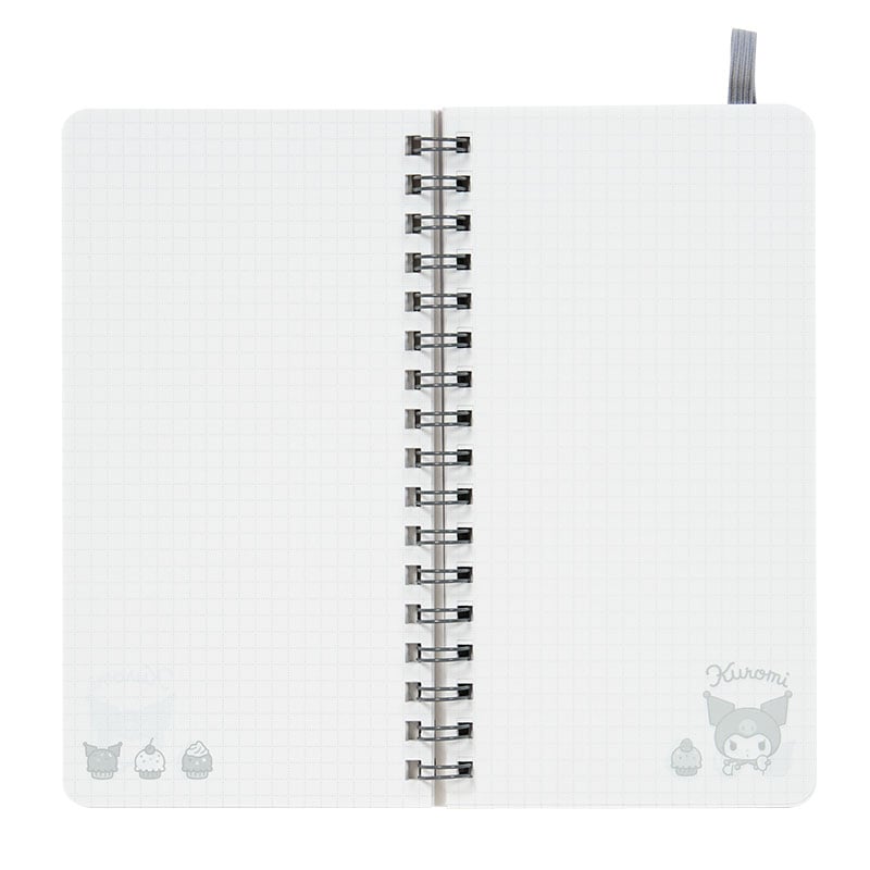 Open top spiral notebook lying flat with visible ruled pages and compact size