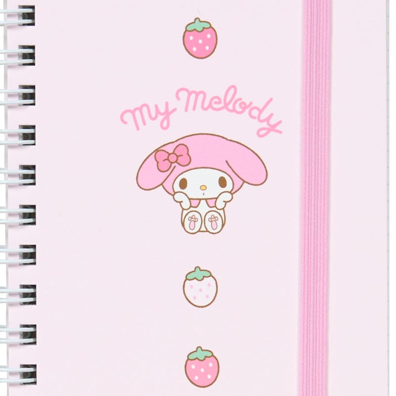 Compact 3 subject spiral notebook being packed into a handbag for daily use