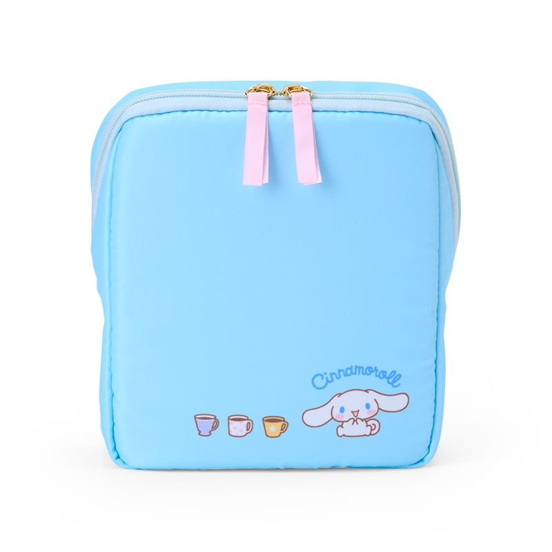 Close-up of Cinnamoroll stationery pouch with flip-top open, showing interior compartments