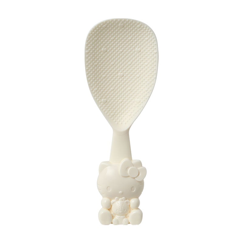 Hello Kitty rice scoop standing upright on a countertop