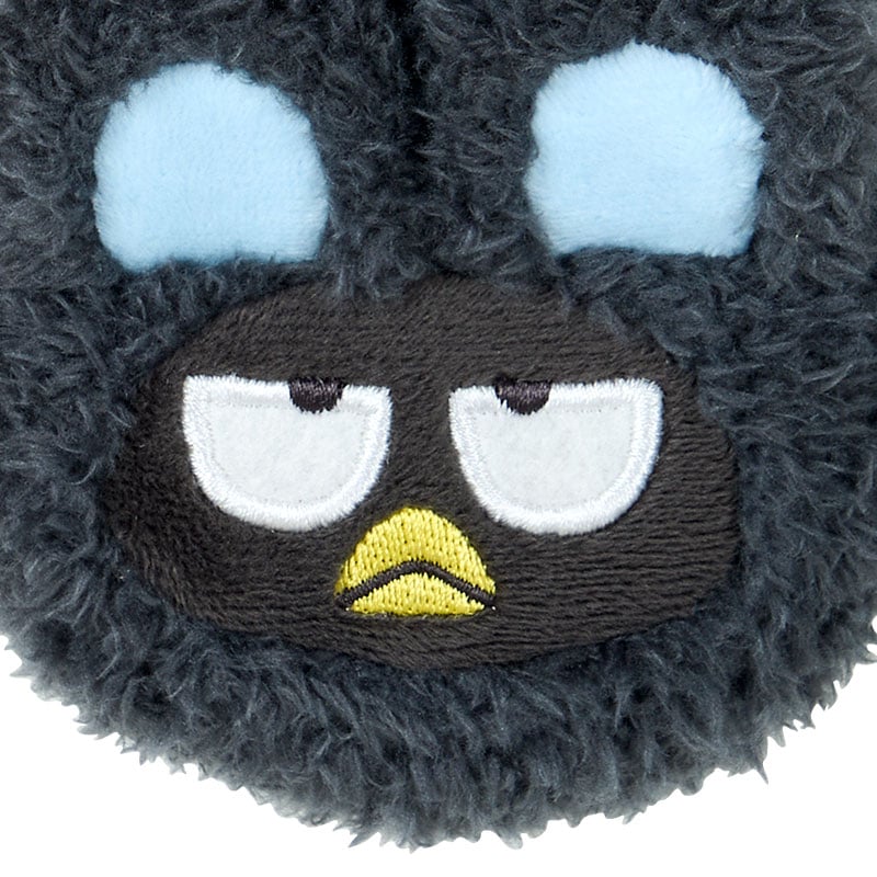 Badtz-maru charm attached to Crocs, demonstrating its coordinating carabiner