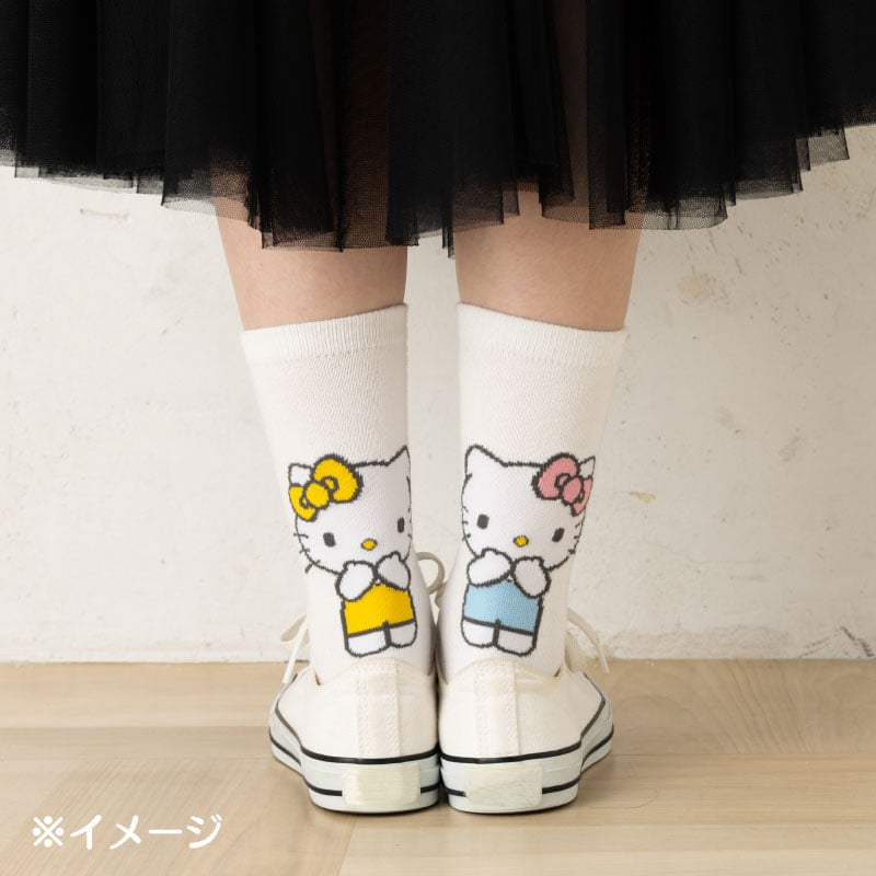 Pair of fun socks for women folded to display playful Sanrio patterns