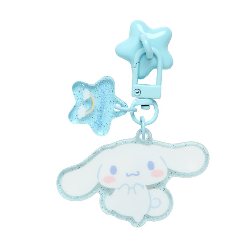 Cinnamoroll charm attached to a smartphone case on a flat surface