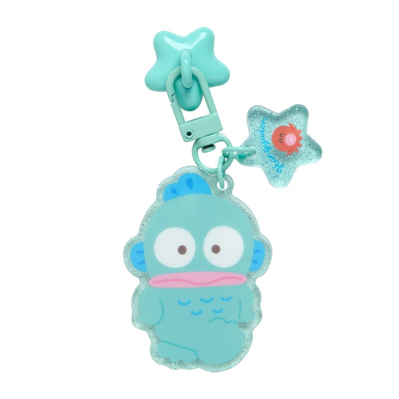 Close-up of Hangyodon adhesive phone charm on a smartphone case with colorful design