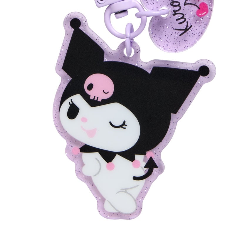 Close-up of Kuromi phone charm on a smartphone, emphasizing its design and colors.