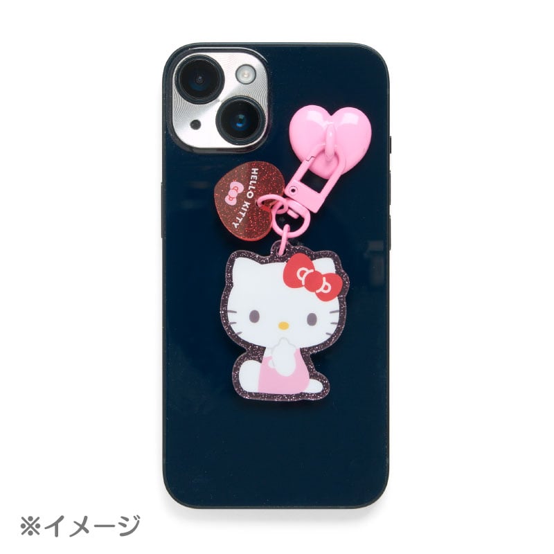 Display of the colorful acrylic Pompompurin phone charm with clasp and adhesive ring