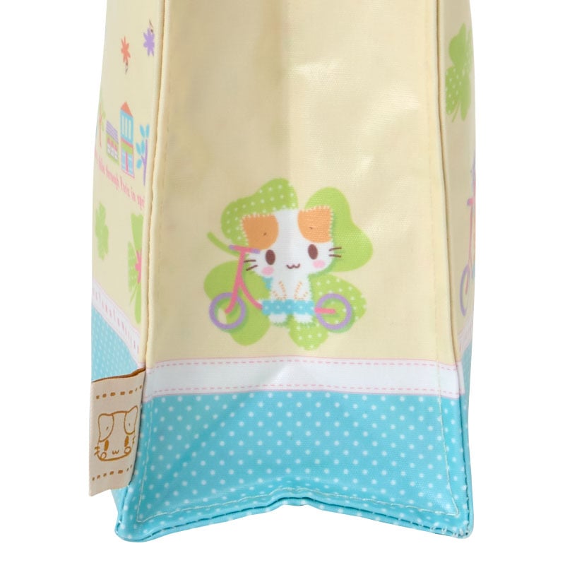 Side angle of the Masyumaro mini tote bag showcasing its internal pocket.