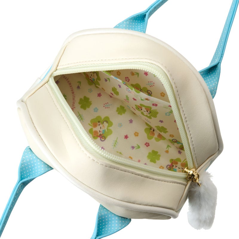 Close-up of internal lining and plush charm accessory