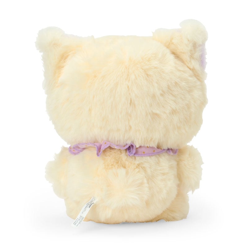 Kuromi plush doll leaning on backpack with natural indoor lighting for warm display