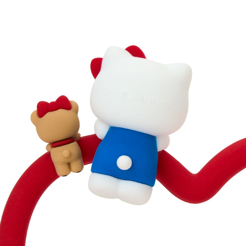 Hello Kitty Besties wrist ring displayed on a table, showing its heart-shaped design and colors