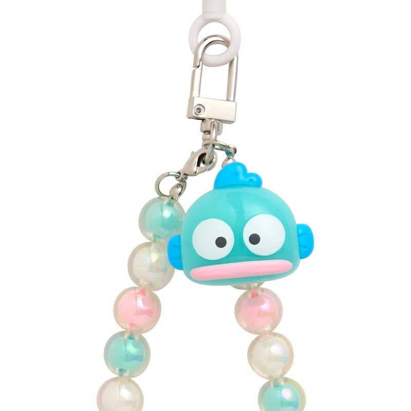 Detail shot of acrylic beads and Sanrio character on smartphone charm
