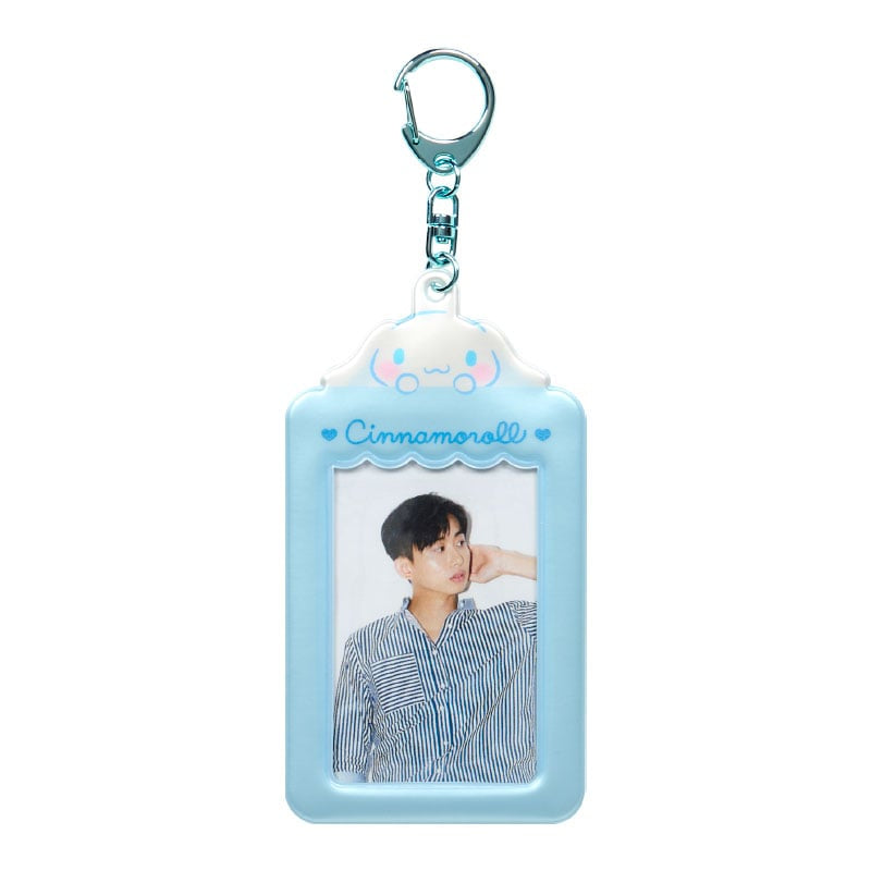 Cinnamoroll bag charm keychain being clipped onto a bag.
