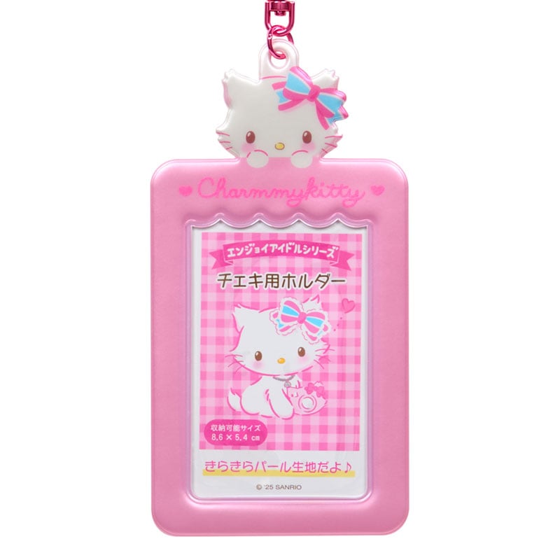 Charmmy Kitty hold showcasing a trading card inside.