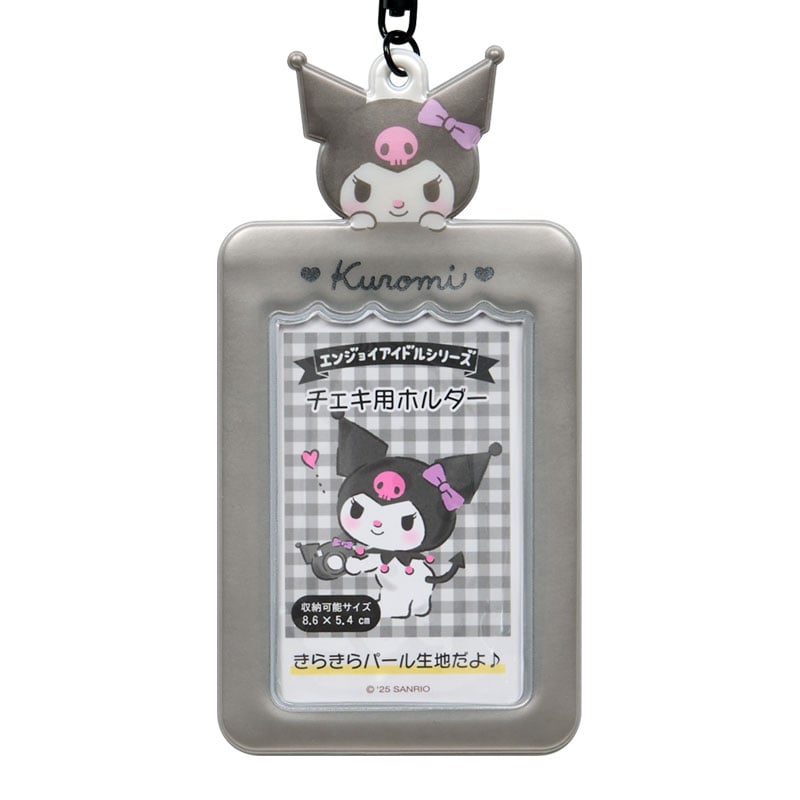 A hand holding the Kuromi keychain charm photo holder with a picture inside.