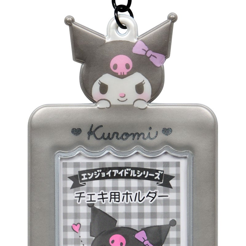 Kuromi character details on the photo holder charm displayed on a table.