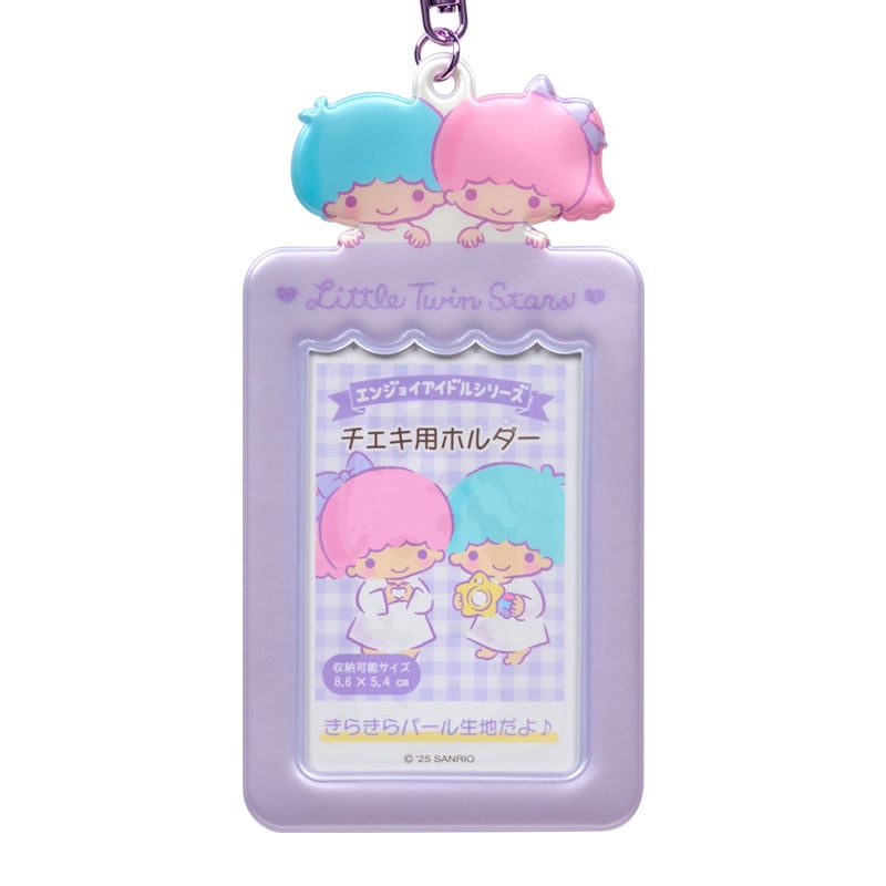 Little Twin Stars charm clipped to a bag, showcasing its cute design.