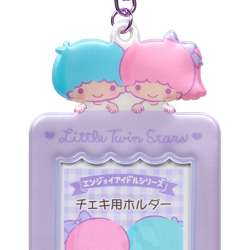 Close-up of the Sanrio photo card holder charm with character details.