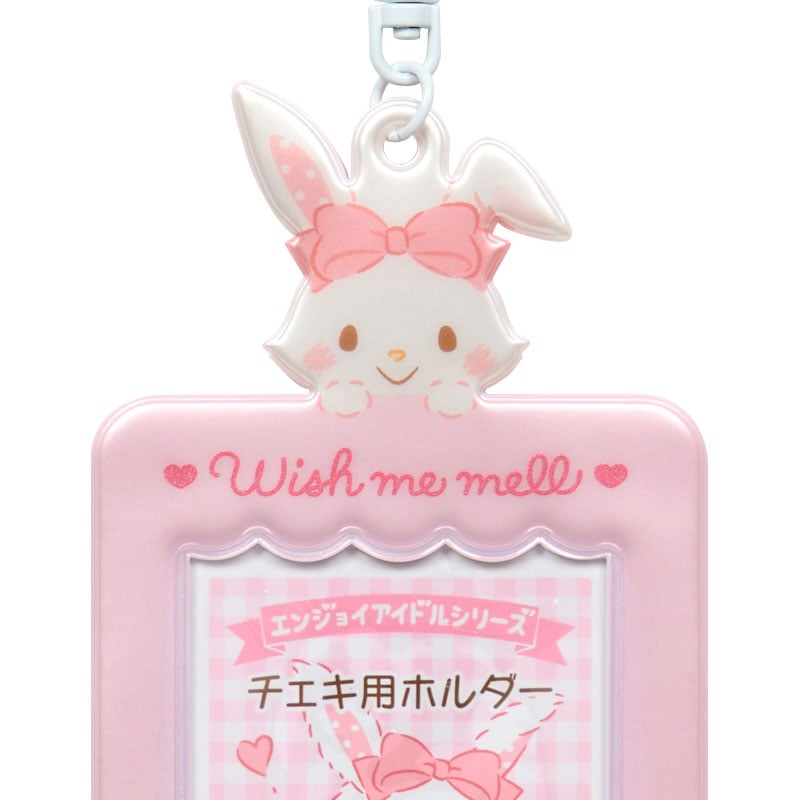 Close-up of the Sanrio charm attached to a bag.