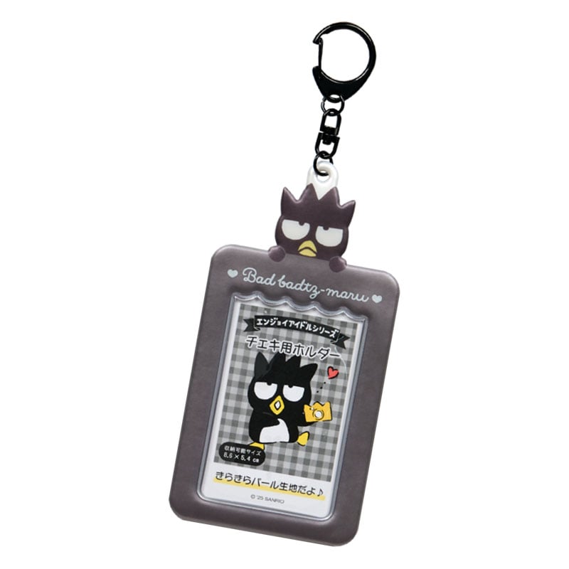 Close-up of Badtz-Maru charm keychain clipped to denim bag
