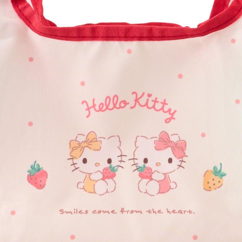Side angle showing foldable design of reusable lunch tote with internal pocket