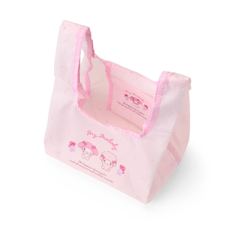 Reusable lunch tote bag with character design, folded and stored