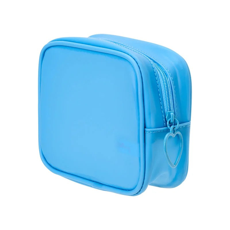 Mesh pouch with embroidered details tucked into a handbag