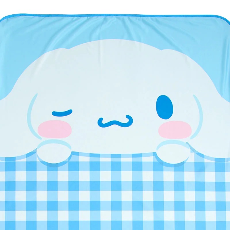 Close-up of the smooth, cool fabric of the Sanrio character blanket