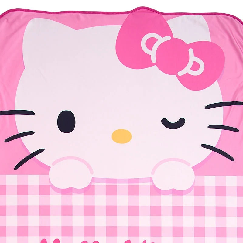 Child wrapped in the Hello Kitty kids blanket, smiling during a cozy afternoon nap.