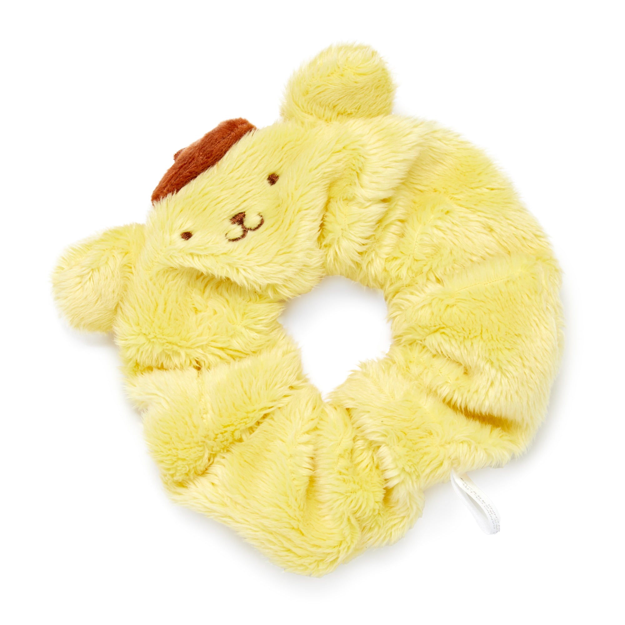 Pompompurin scrunchie wrapped around a blonde ponytail in sunlight