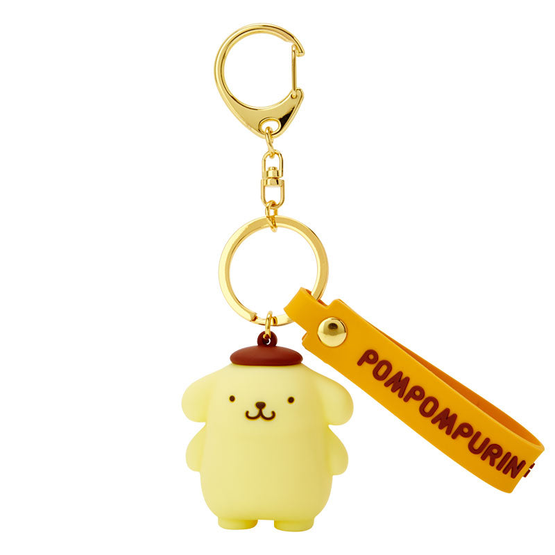 Pompompurin Sanrio character keychain with gold lobster clasp attached to a set of car keys