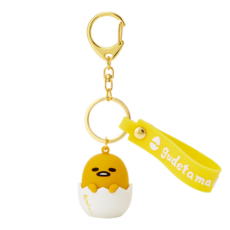 Close-up of Gudetama charm keychain with gold clasp