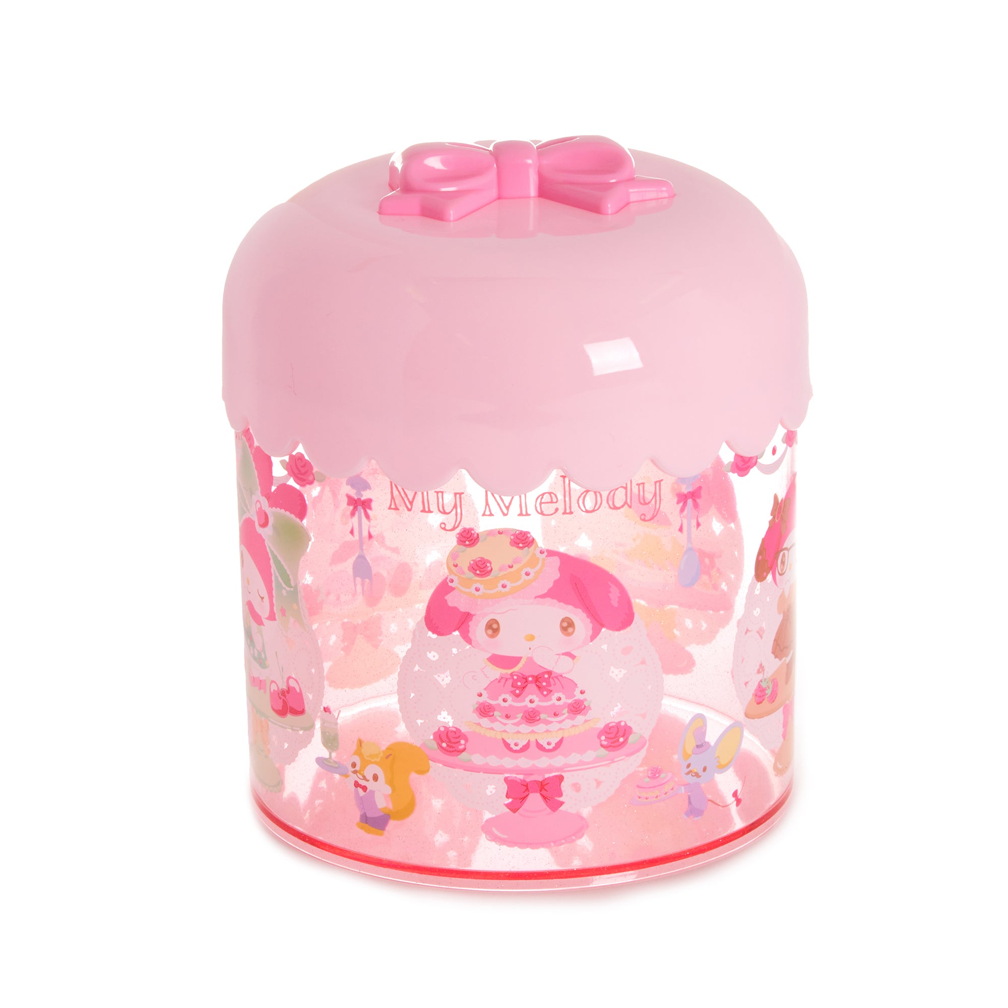 Top view of pink canister jar on marble counter with cotton pads inside