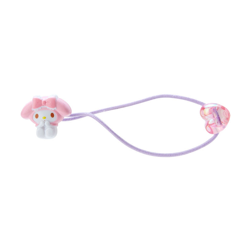 Front view of My Melody plush hair tie with holographic heart charm on white surface.