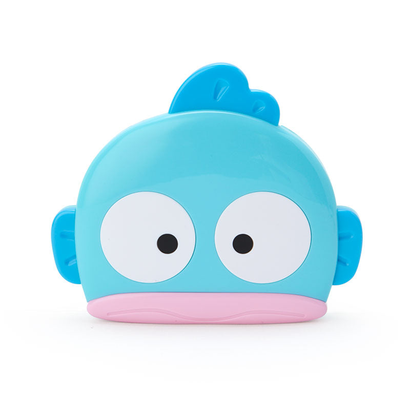 Front view of Hangyodon portable mirror and comb set on pastel background
