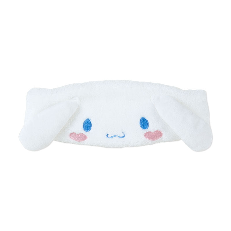 Cute Cinnamoroll plush headband holding hair back during skincare routine