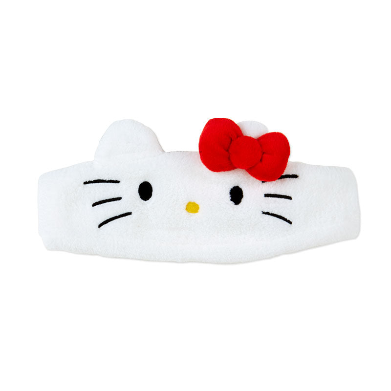 Hello Kitty plush headband being worn during a makeup routine, keeping hair back and out of the face.