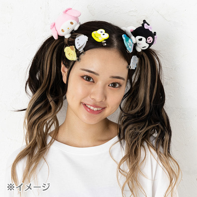Front view of Pompompurin plush hair clip on a light background
