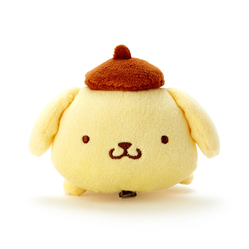 Front view of Pompompurin plush hair clip on a light background