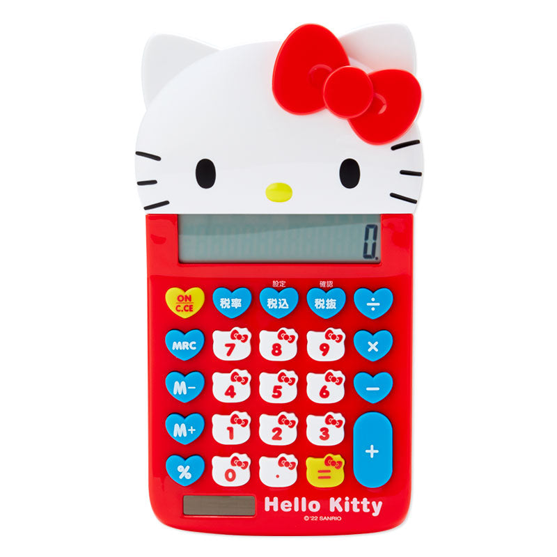 Hello Kitty calculator displayed on a notebook with pens for scale
